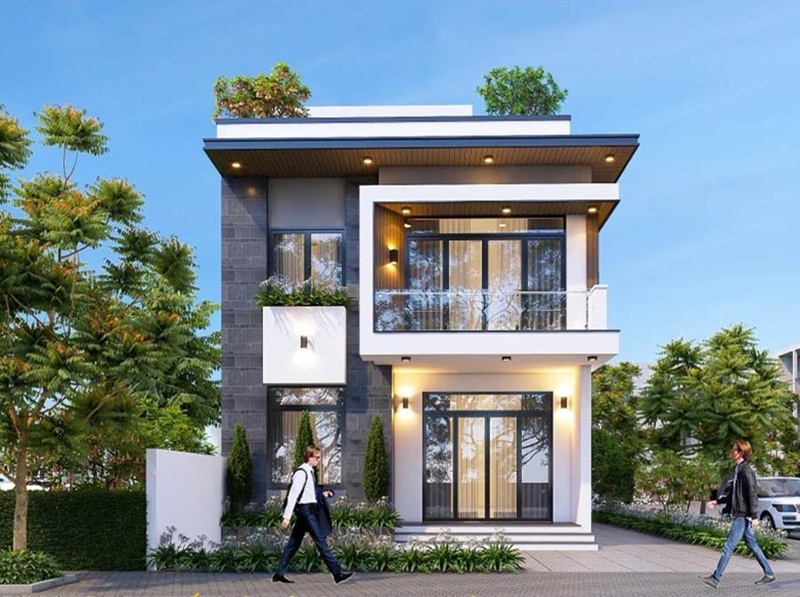 Nhà phố 2 tầng năng động với tường đá xám thanh lịch và ban công kính hiện đại